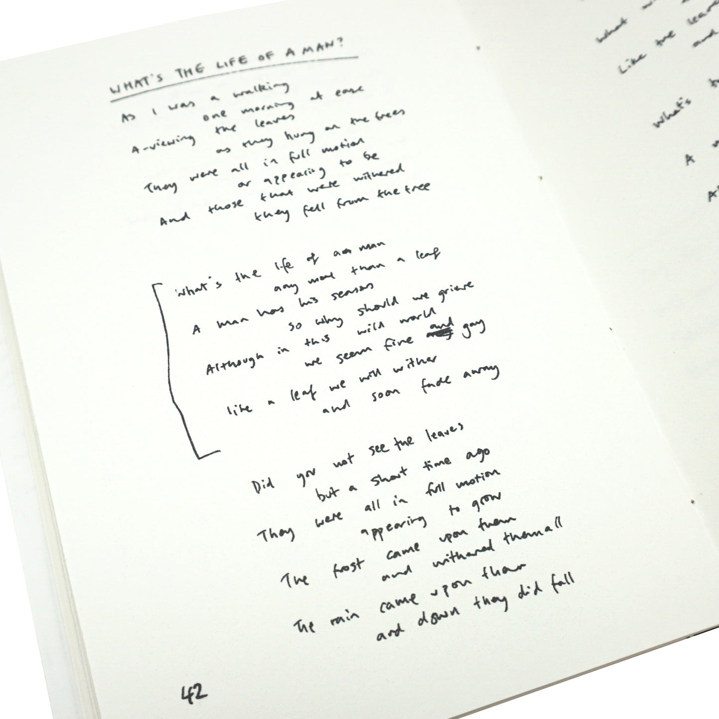 Handwritten text on a white sheet of paper