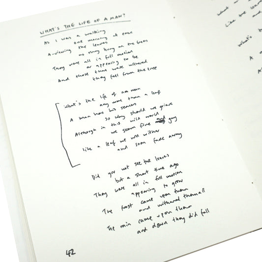 Handwritten text on a white sheet of paper