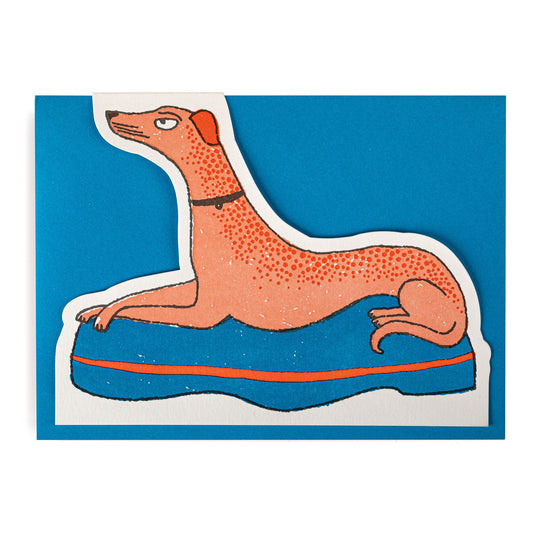Illustration of an orange dog with crossed paws on a blue envelope
