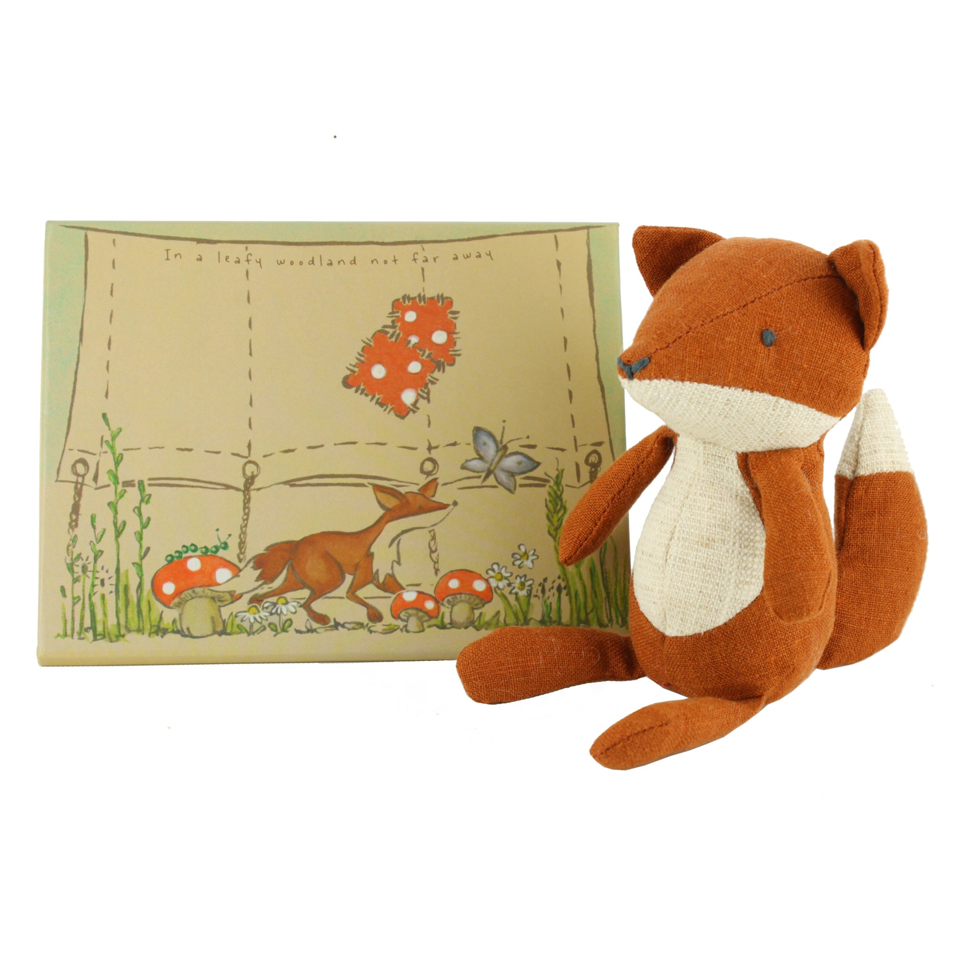 Plush fox toy with a presentation box on a white background