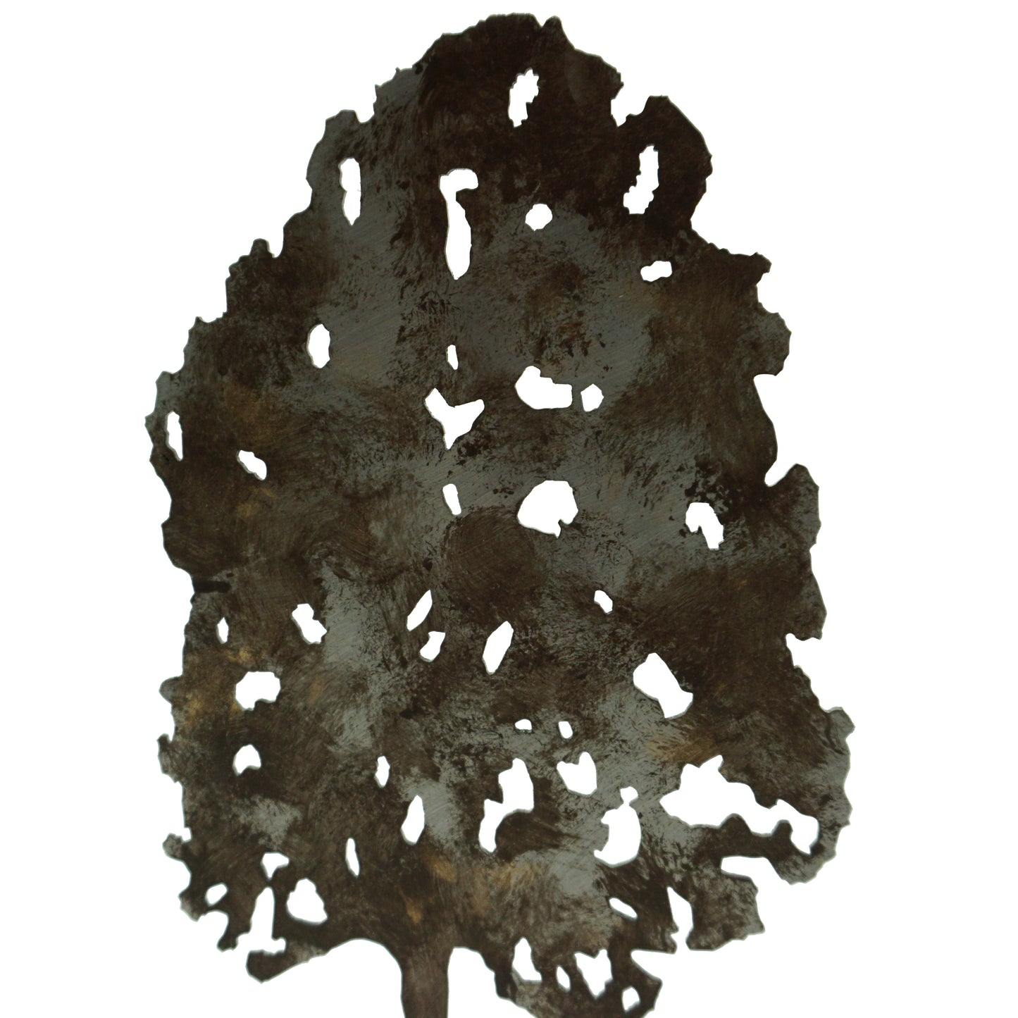 A close up detail of a laser cut tree shape featuring wavy cut holes inside the tree.