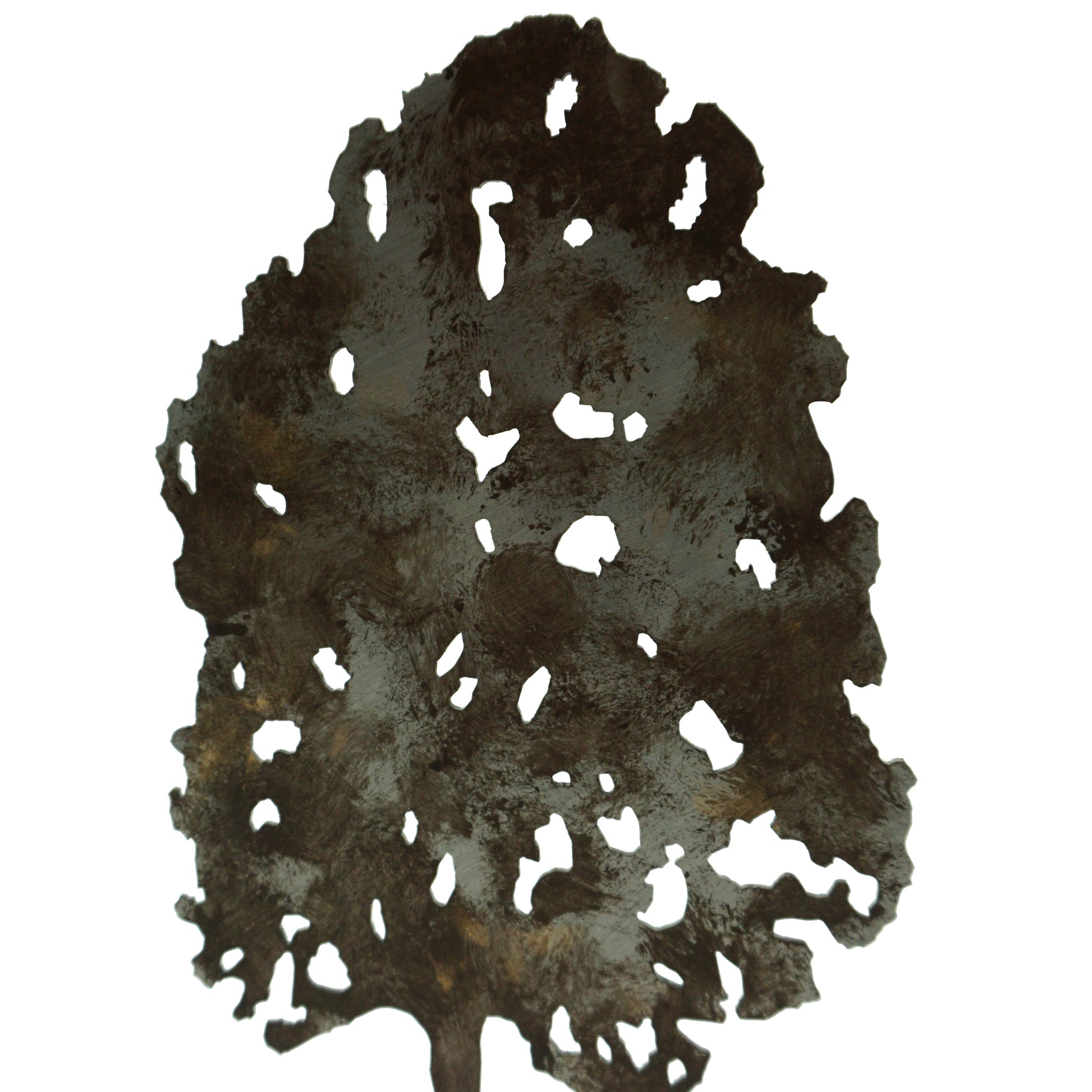 A close up detail of a laser cut tree shape featuring wavy cut holes inside the tree.