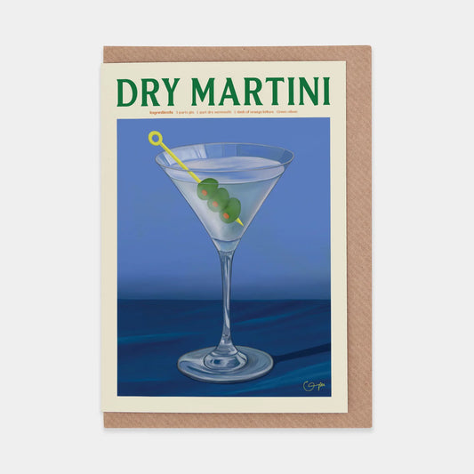A vintage-style illustration of a dry martini in a classic cocktail glass, garnished with three green olives on a skewer. The background is a soft blue, and the words "DRY MARTINI" are prominently displayed at the top.