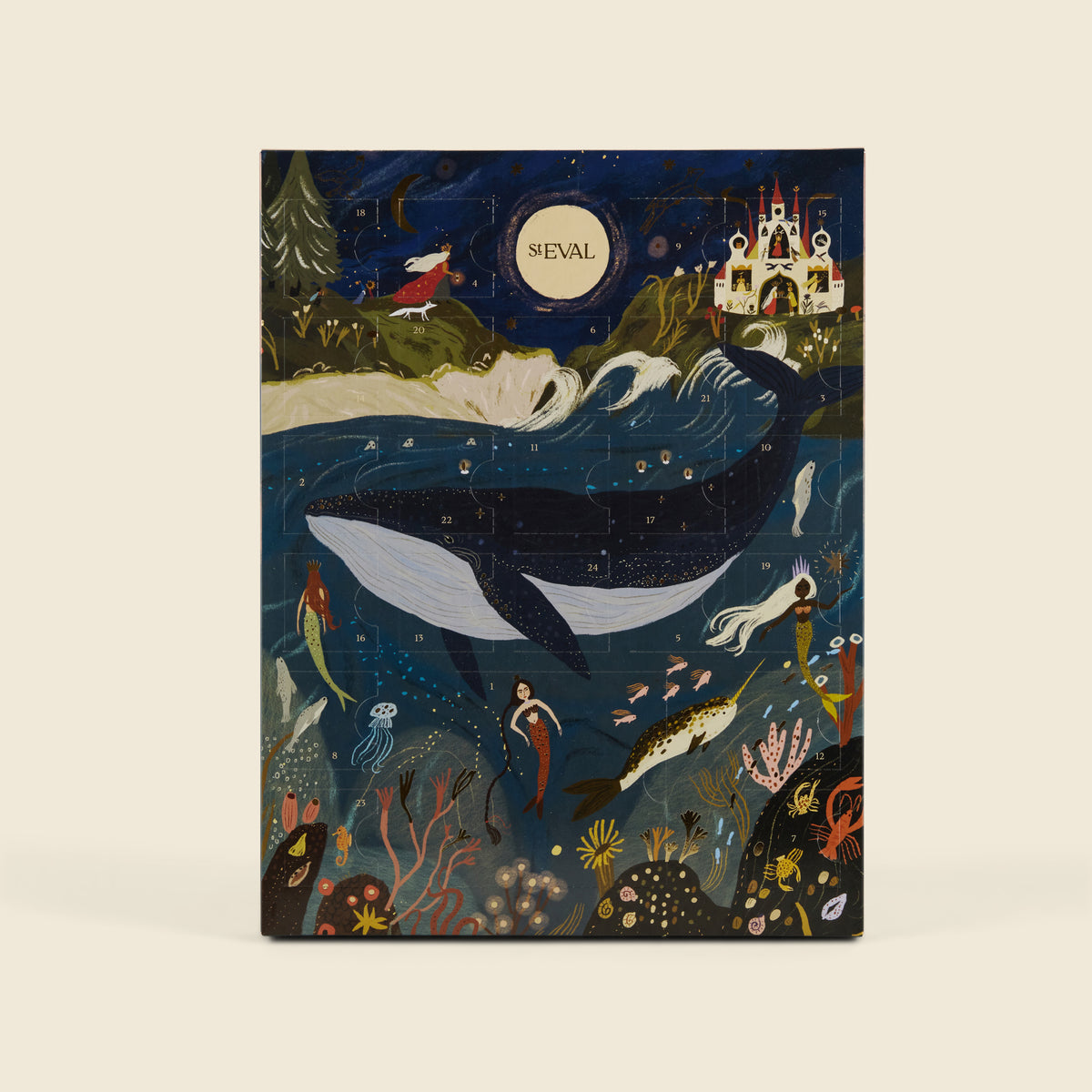 A rectangular advent calendar featuring a whimsical underwater fantasy scene with a large whale, mermaids, sea creatures, stars, and a castle. The word 'ST EVAL' appears in a circular moon-like emblem near the top centre.