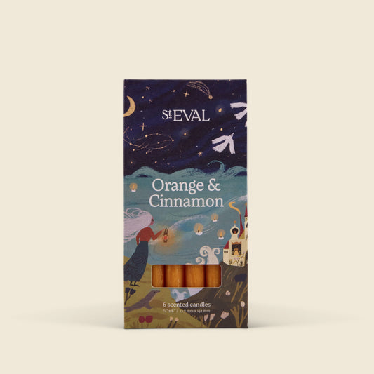 St Eval Orange & Cinnamon scented candles in a decorative illustrated box, photographed against a plain light beige background.