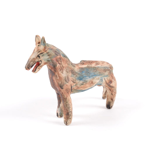 A painted ceramic wolf whistle in shades of brown and blue standing on a plain white background.