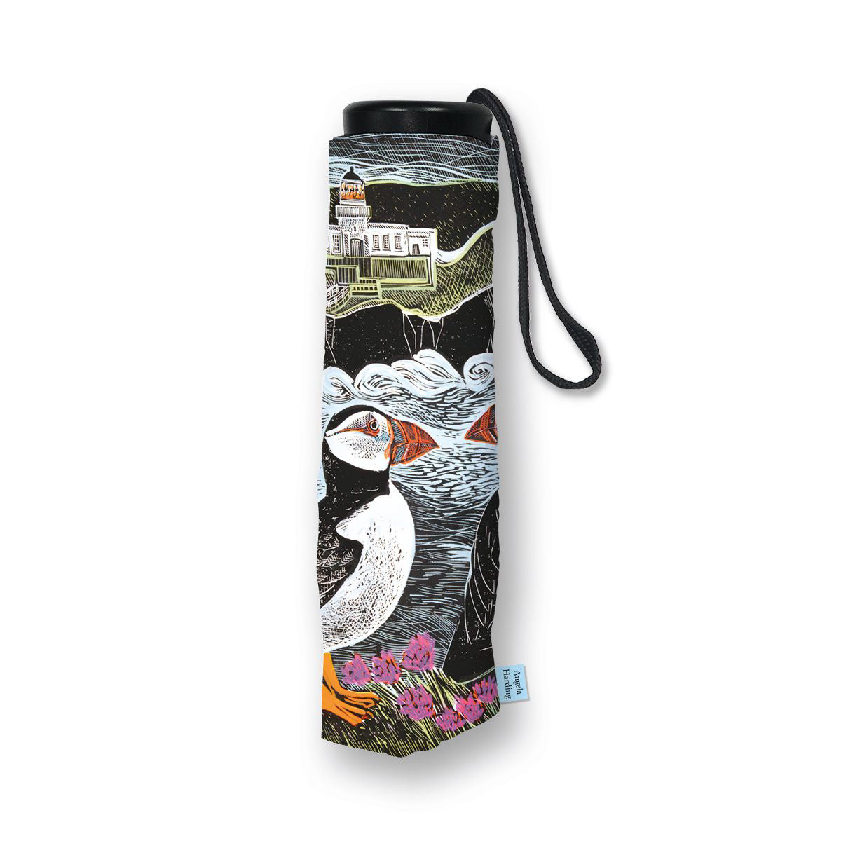 A rolled-up black umbrella with a wrist strap, featuring a detailed illustration of puffins, waves, and a lighthouse on the fabric. A small blue tag is visible at the bottom right.
