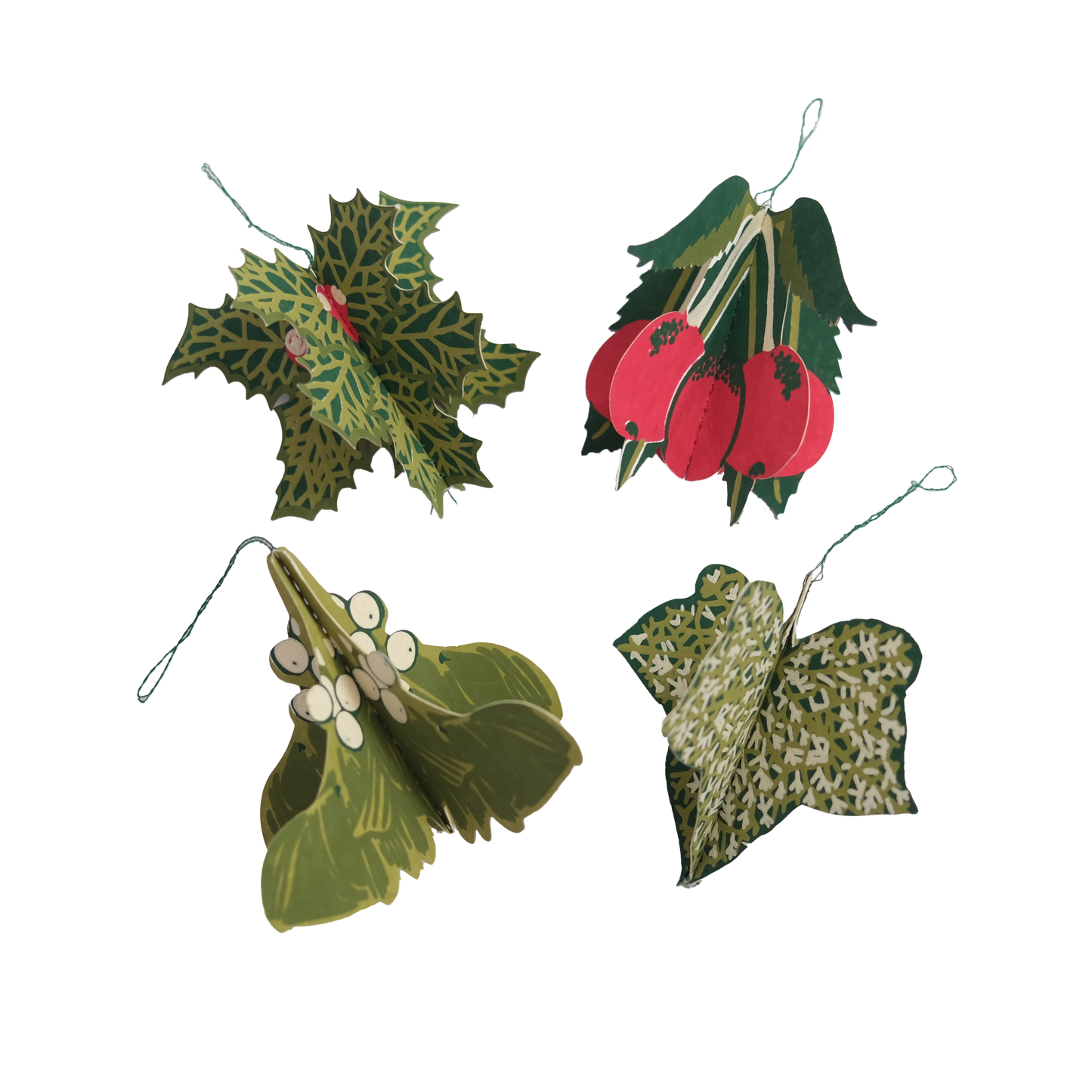Set of four decorative holly leaves with berries on a white background