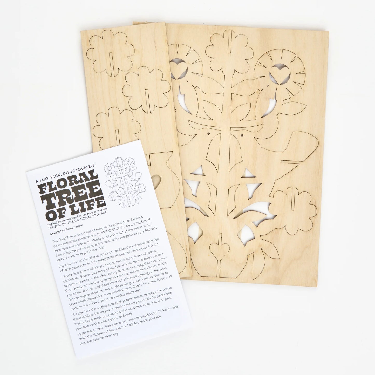 Laser cut wooden sheet showing the floral tree of life design ready to pop out with instructions on a white background