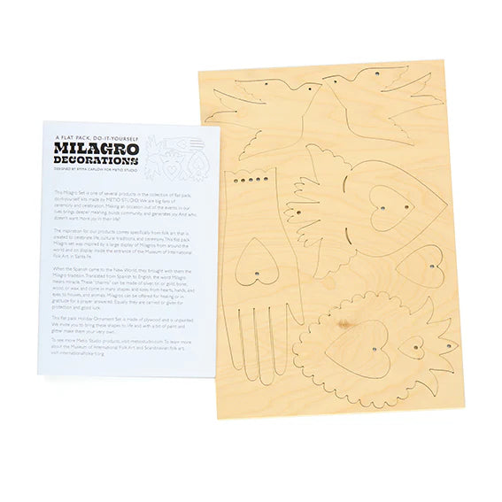 Sheet of plywood cut-out shapes with instructions on a white background