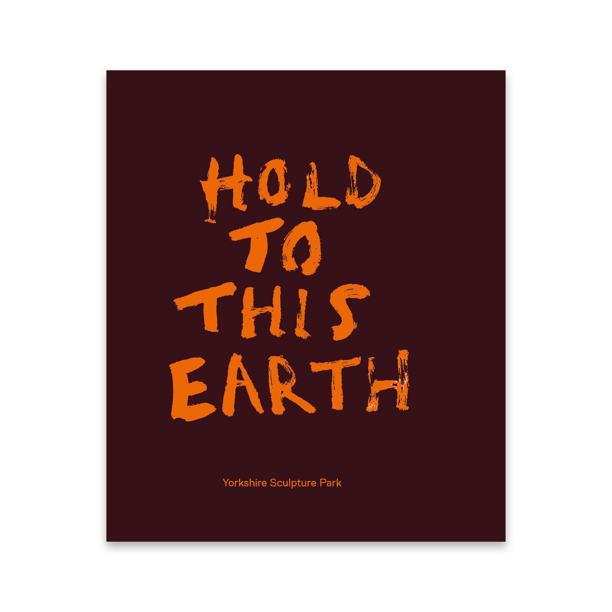A square exhibition catalogue with a dark burgundy background and large distressed orange text reading “HOLD TO THIS EARTH.” Smaller orange text near the bottom reads “Yorkshire Sculpture Park.