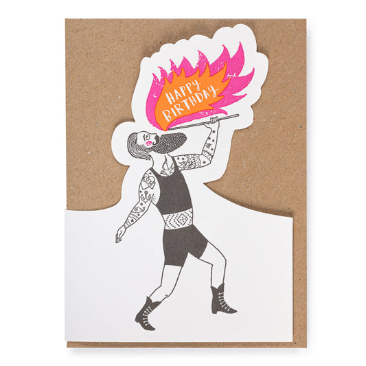 Greeting card with a person breathing fire and 'Happy Birthday' text on a kraft paper envelope.