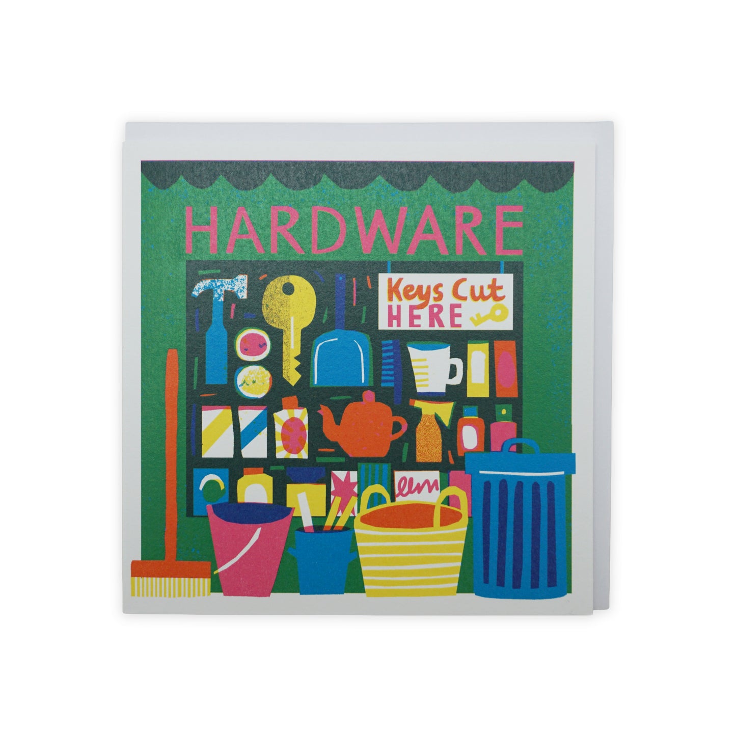 A vibrant illustration of a hardware store front, featuring shelves filled with tools, paint cans, and household items. Brightly coloured buckets and a broom are displayed in the foreground, with a sign reading "Keys Cut Here" prominently featured.