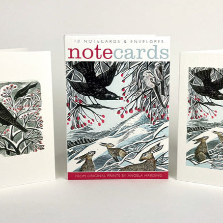 Set of note cards by print maker Angela Harding with Christmas and nature-themed designs on a white background