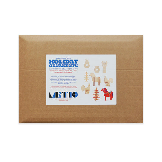 Brown cardboard rectangular box of holiday ornaments with a label on a white background.