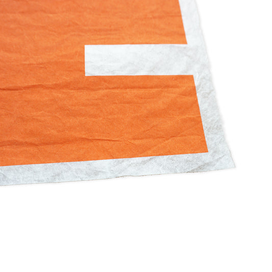 Close-up of an orange and white washi paper corner