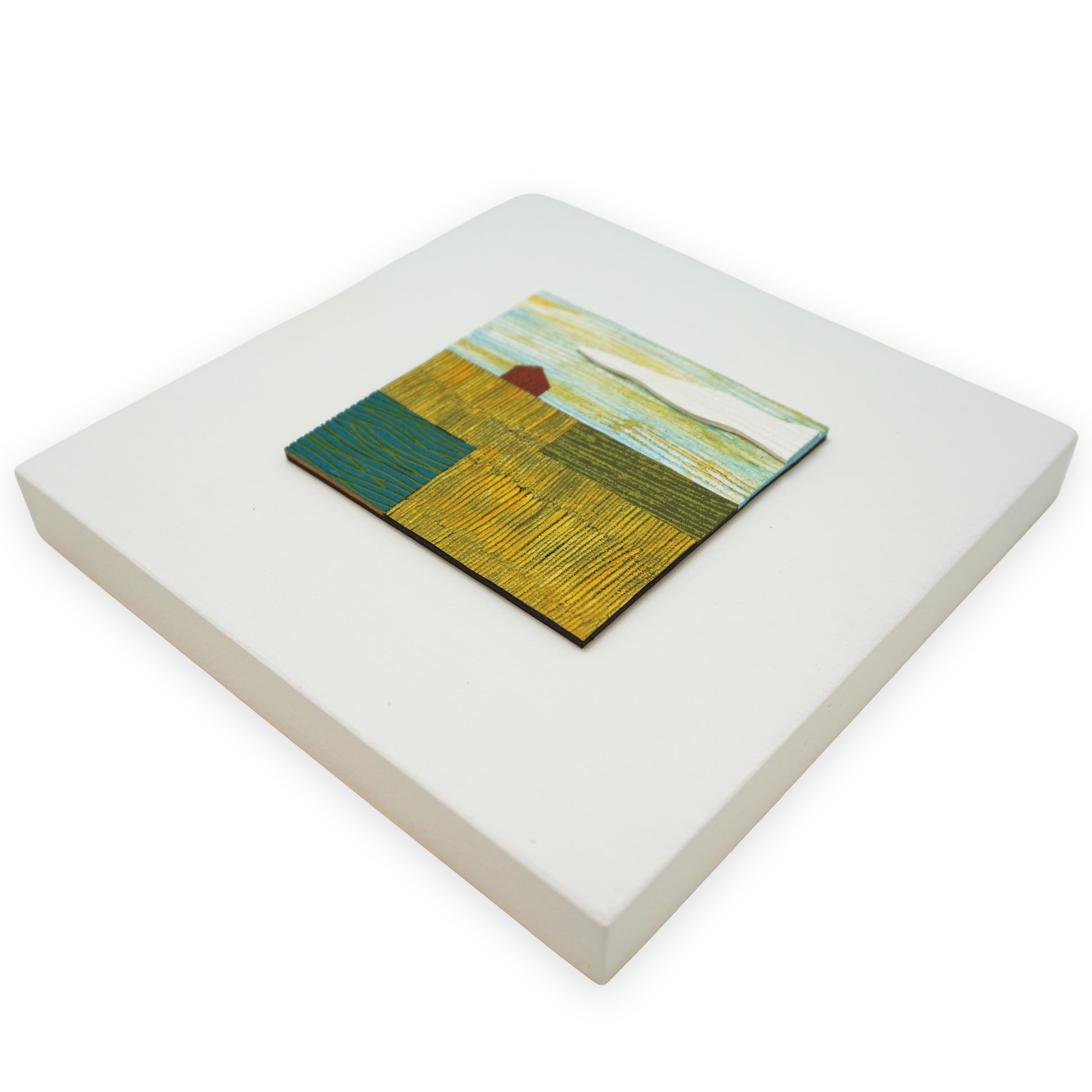 Small abstract leather collage on a white background. The artwork uses strong tones of yellow and green throughout.
