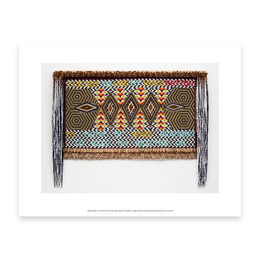 A vibrant textile artwork featuring geometric patterns in bold colours, including red, yellow, and black. The piece includes the text "I've got one imagination to good reason" woven into the design, framed with decorative fringes.