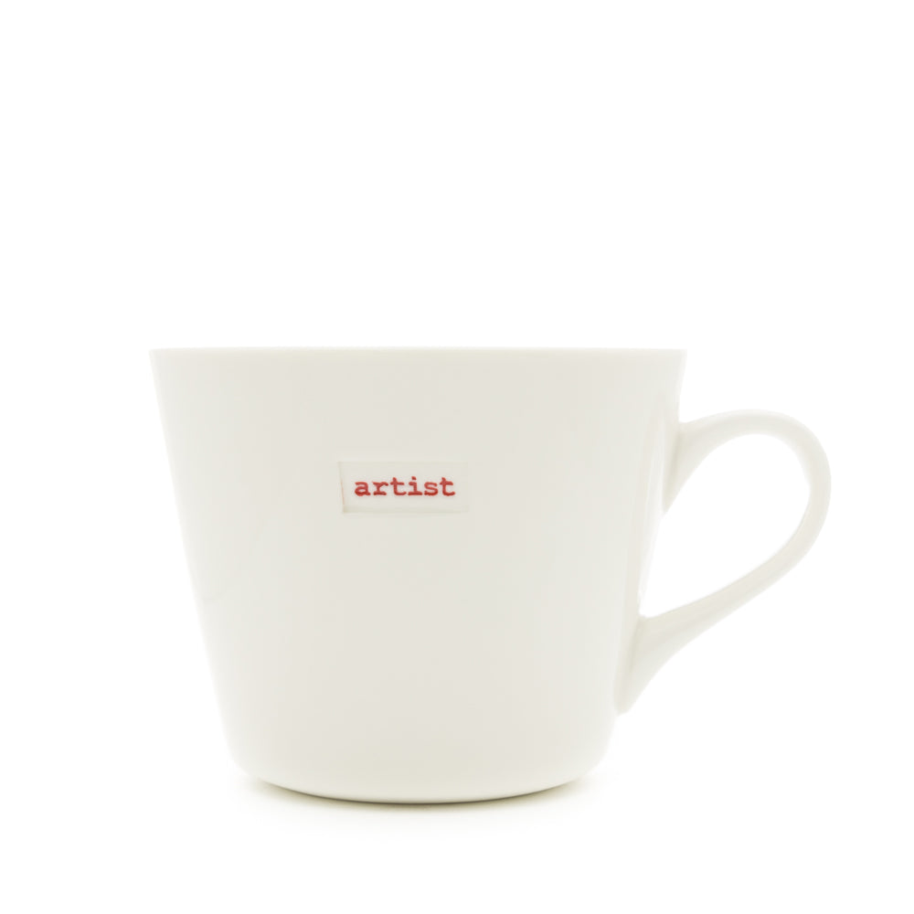 A white Keith Brymer Jones medium bucket mug with the word 'artist' stamped in red on the front.