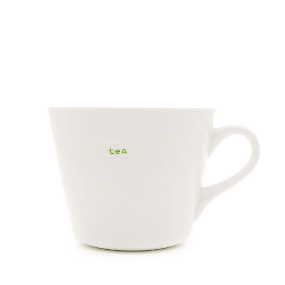 A white Keith Brymer Jones medium bucket mug with the word 'tea' stamped in red on the front.