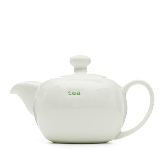 A white ceramic tea pot with 'tea' text on the side, designed by Keith Brymer Jones.