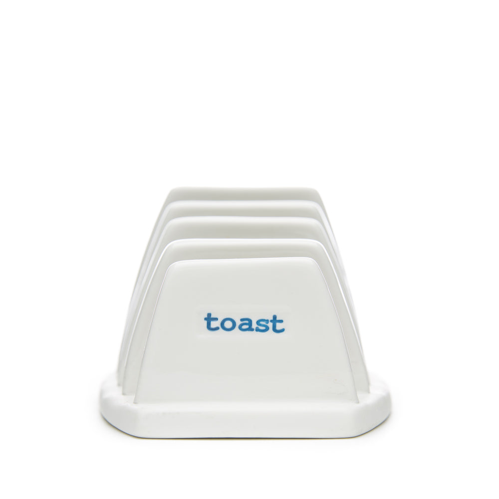 A white ceramic toast rack with 'toast' text on the side, designed by Keith Brymer Jones.