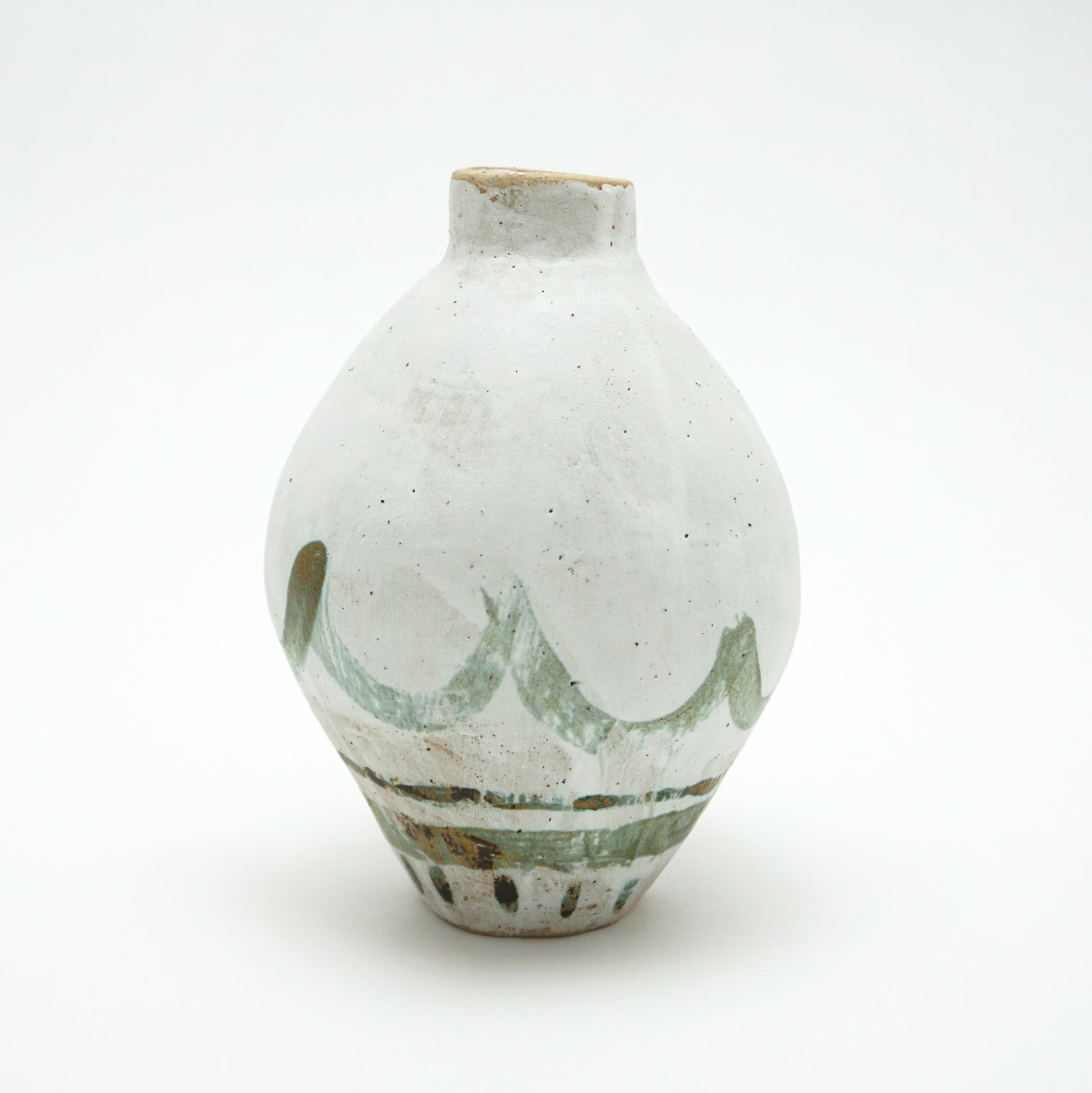 White ceramic oval vase with green and brown glazed accents on a white background. The green and brown glaze is painted on in swooping lines.