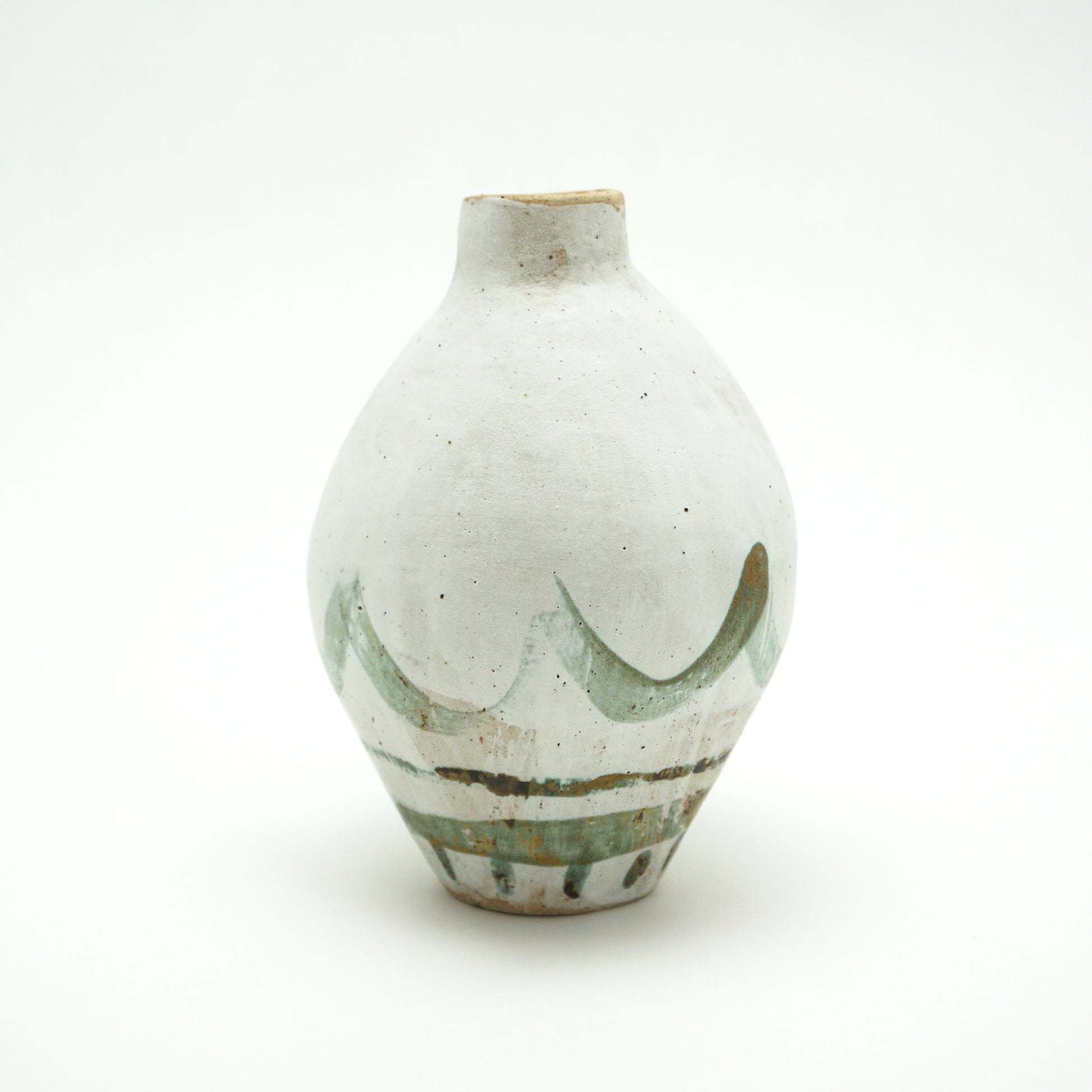 White ceramic oval vase with green and brown glazed accents on a white background. The green and brown glaze is painted on in swooping lines.