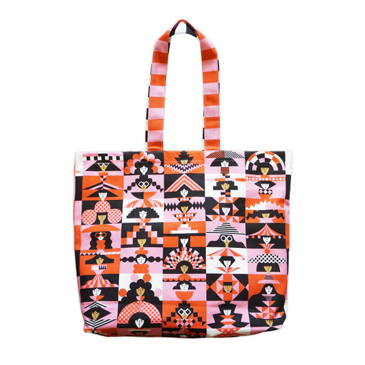 Tote bag with a colourful, geometric pattern of faces wearing different hats and sunglasses on a plain white background.