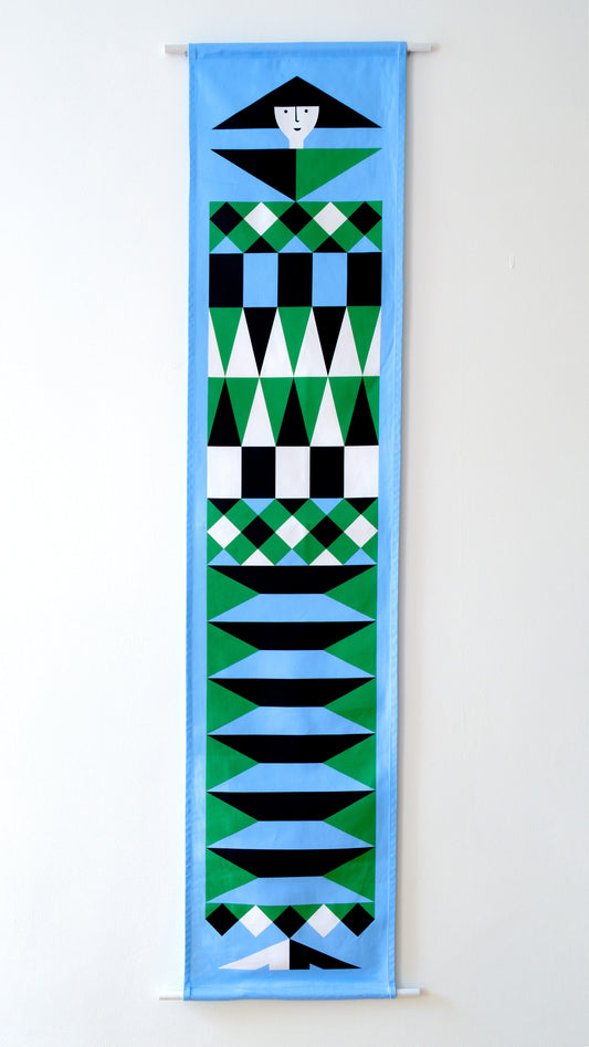 A fabric banner featuring a blue and green geometric figure with black and white accents. 
