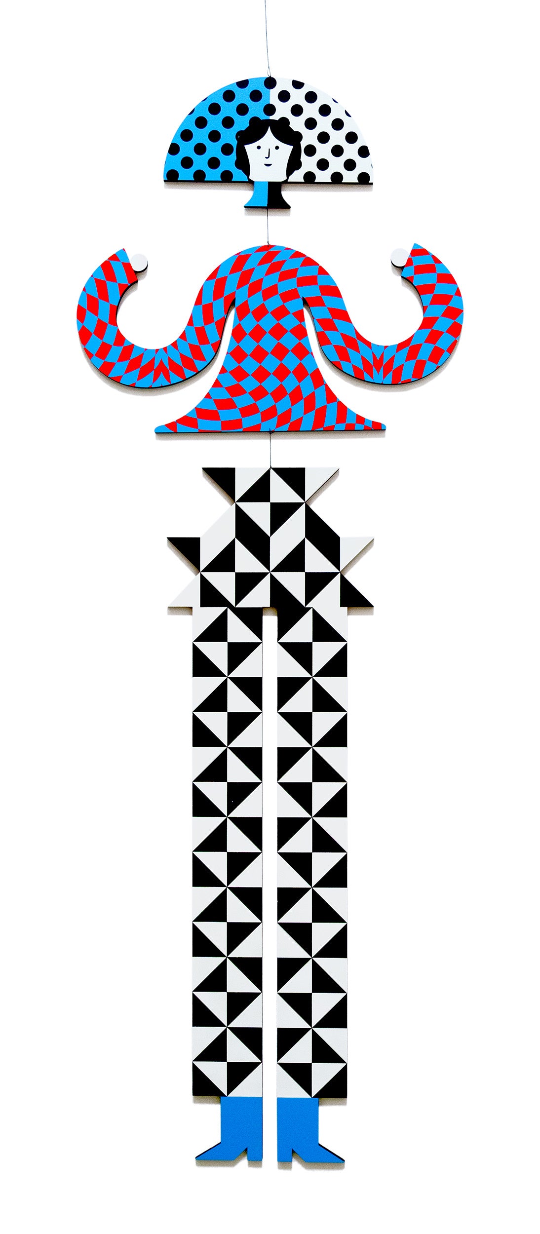 Geometrically patterned hanging mobile figure with a checked top and red and blue geometric body on a white background.
