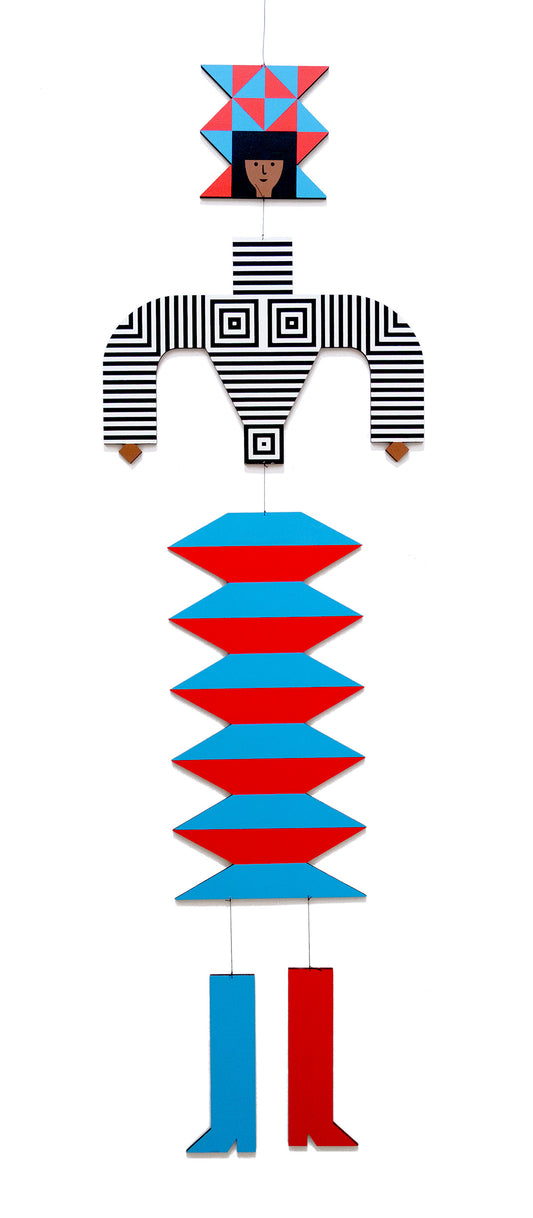 A hanging wooden colourful mobile featuring a full figure with a headdress and boots covered in bright geometric patterns.