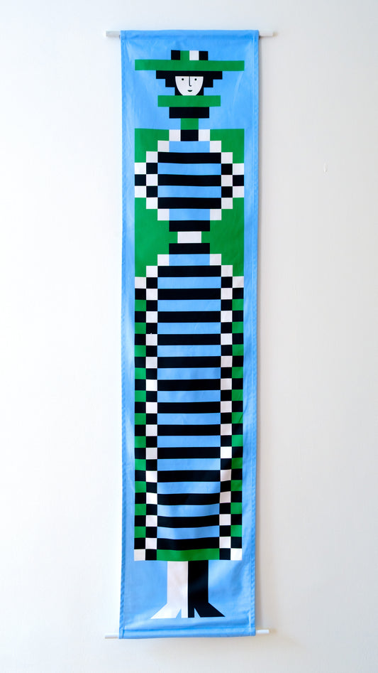 A fabric banner featuring a blue and green geometric figure with black and white accents. 
