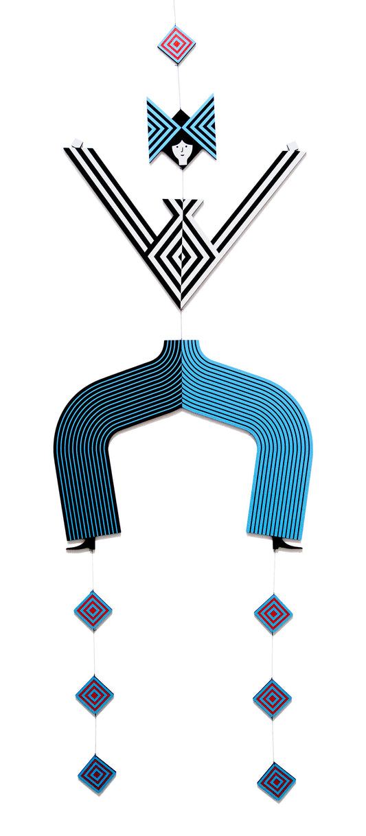 A hanging wooden colourful mobile featuring a full figure with a headdress and boots covered in bright geometric patterns.