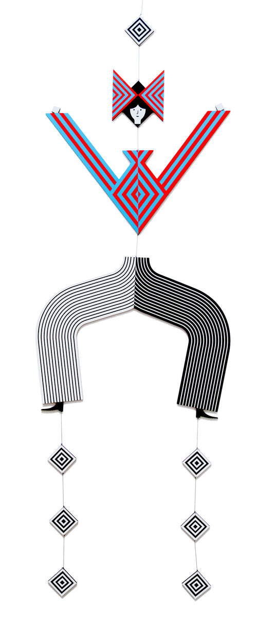 A hanging wooden colourful mobile featuring a full figure with a headdress and boots covered in bright geometric patterns.