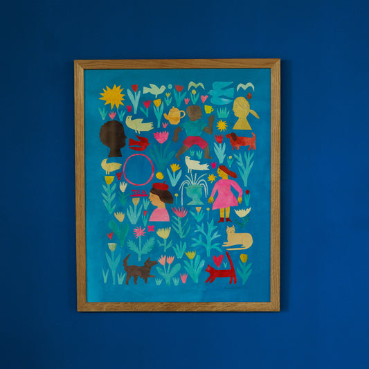 A vibrant artwork featuring a collage of colourful figures, animals, and flowers against a bright blue background. The framed piece includes silhouettes, playful shapes, and various whimsical elements, creating a lively and cheerful scene.
