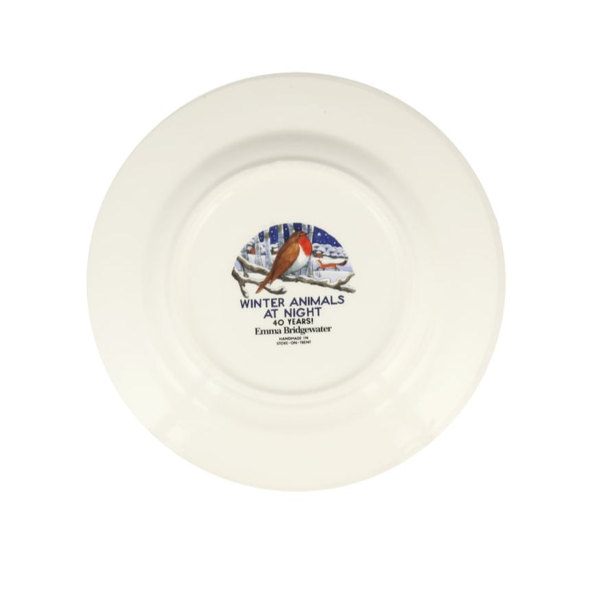 White ceramic plate with a decorative design and text on a white background