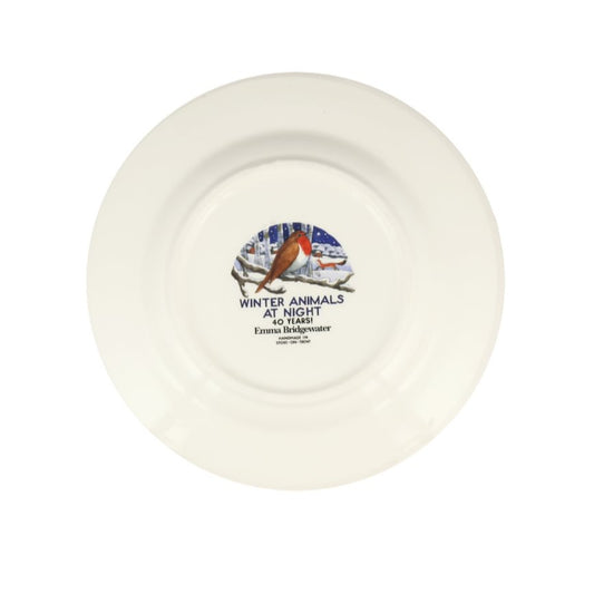 White ceramic plate with a decorative design and text on a white background