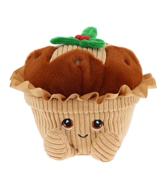 A plush toy shaped like a Mince Pie, with a brown fuzzy top, beige ribbed wrapper, and a small green holly accent on top. The face is embroidered with brown eyes and a small smile, set against a plain white background.