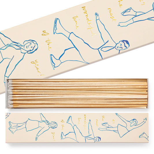 Set of long wooden matches in a box with illustrated ice skaters on the front.