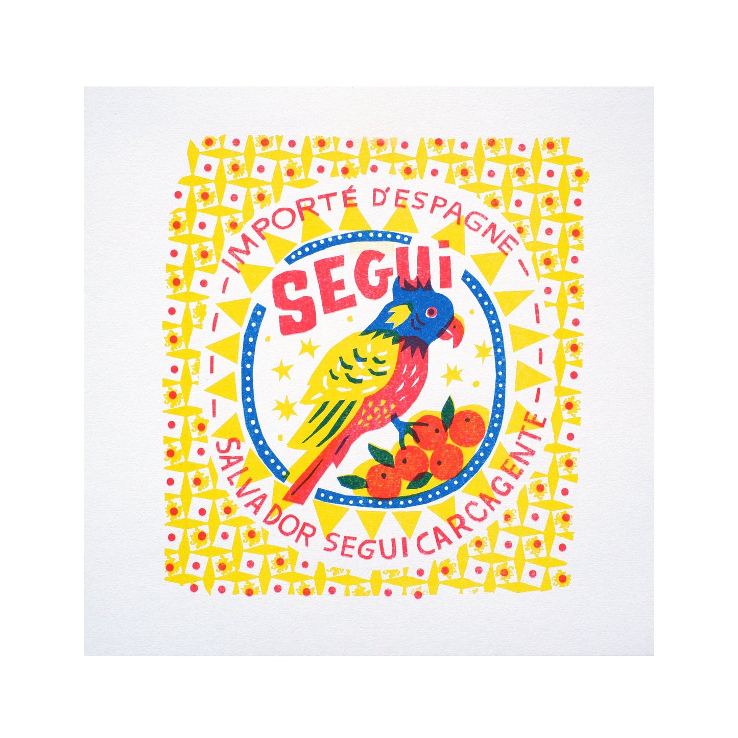 A vibrant graphic design featuring a colourful parrot and oranges, framed by a decorative border. The text reads "Importe d'Espagne" and "Salvador Segui Carcagente," highlighting a Spanish import theme.