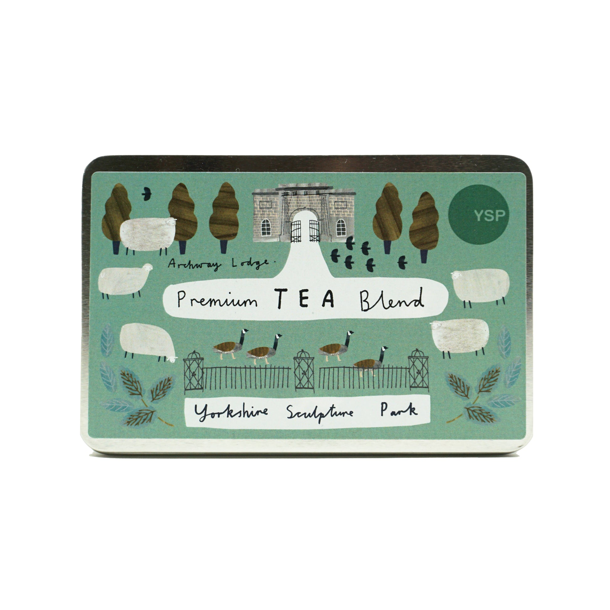 A metal tin of premium tea blend tea bags with a green label featuring illustrated geese, sheep and trees.