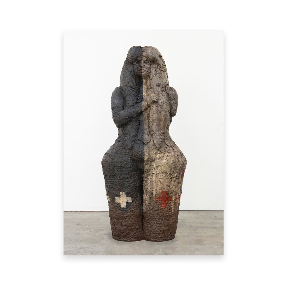 A large, abstract sculpture of a figure, split vertically into two contrasting textures and colours. One side is dark and rough, while the other is lighter and smoother, featuring subtle markings. The figure appears to hold a tall object, evoking a sense of duality.