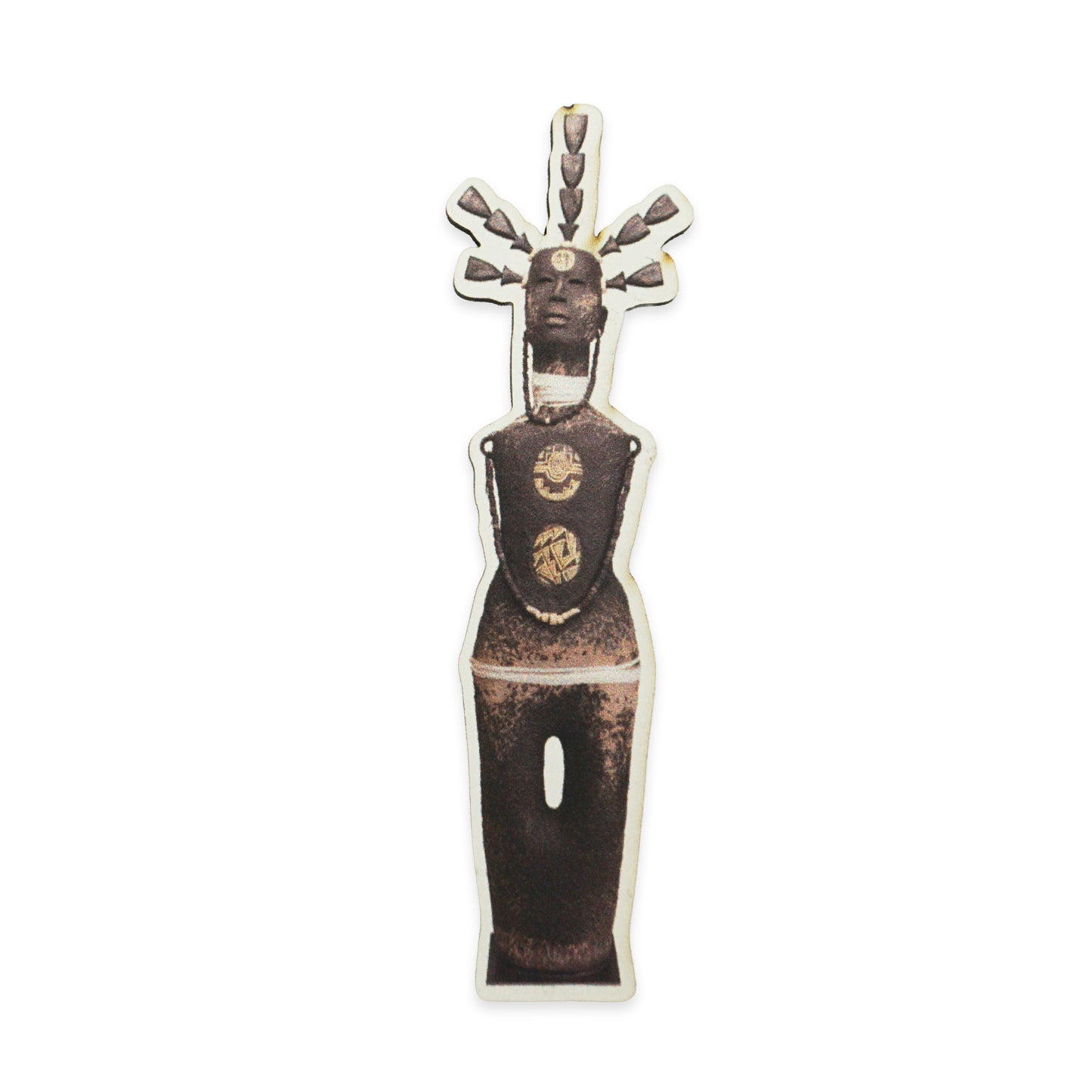 A stylised sculpture of a human figure with an elongated body and head. The figure has a series of protrusions from the top of the head and circular patterns on the torso. The sculpture is dark brown with a textured surface.