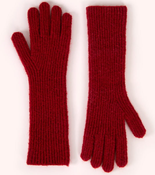 Pair of red knitted gloves on a white background