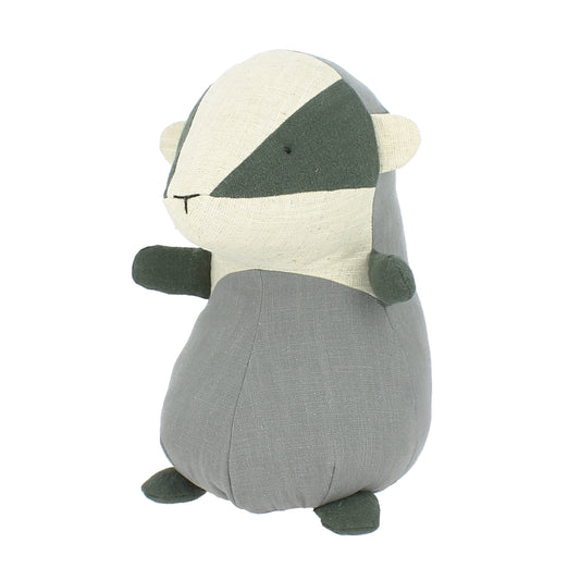 Plush toy badger with grey colour scheme on a white background