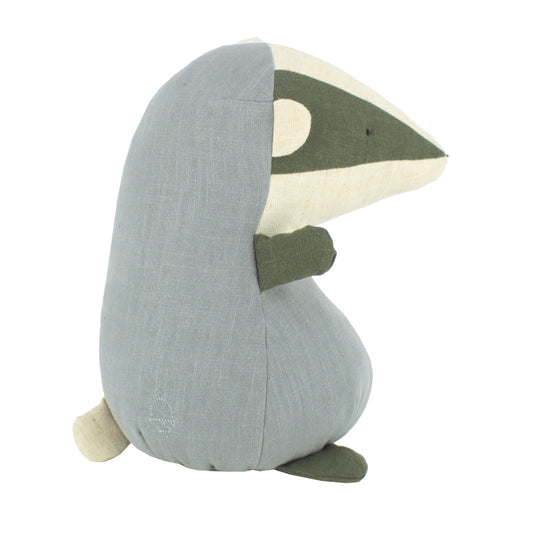 Plush toy badger with grey colour scheme on a white background