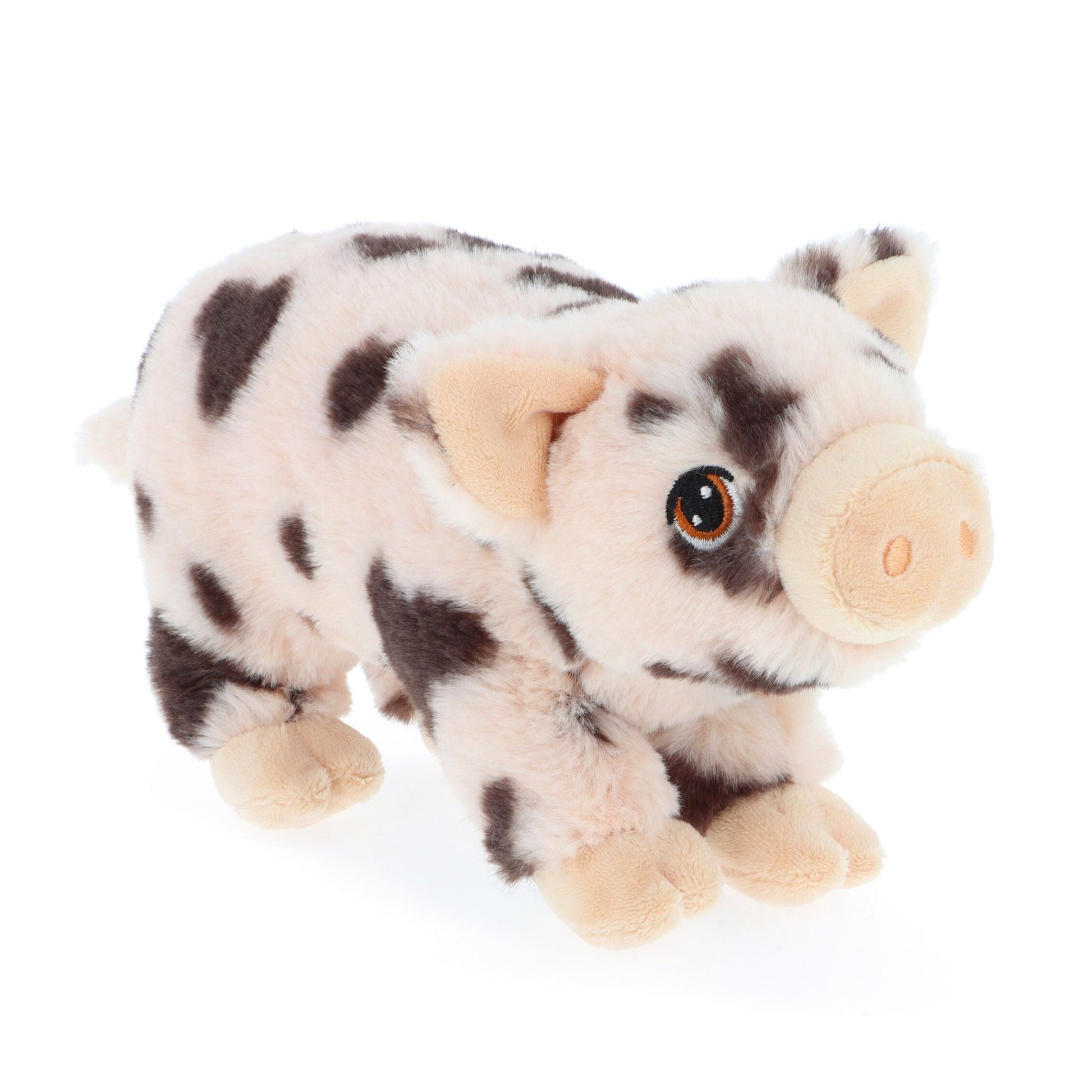 A soft, plush toy pig with a light pink body and black spots. It has large, expressive eyes and small, rounded ears. The pig is posed as if it is playfully trotting forward, showcasing its cuddly and friendly appearance.