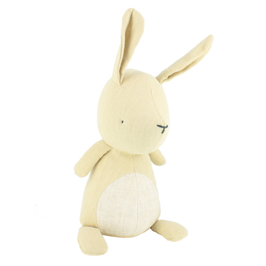 Cream plush bunny toy with long floppy ears on a white background