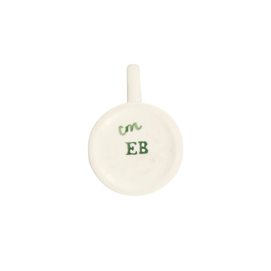 The bottom of a small mug, featuring green handwritten-style text reading 'cm EB' on the base, shown against a plain white background.